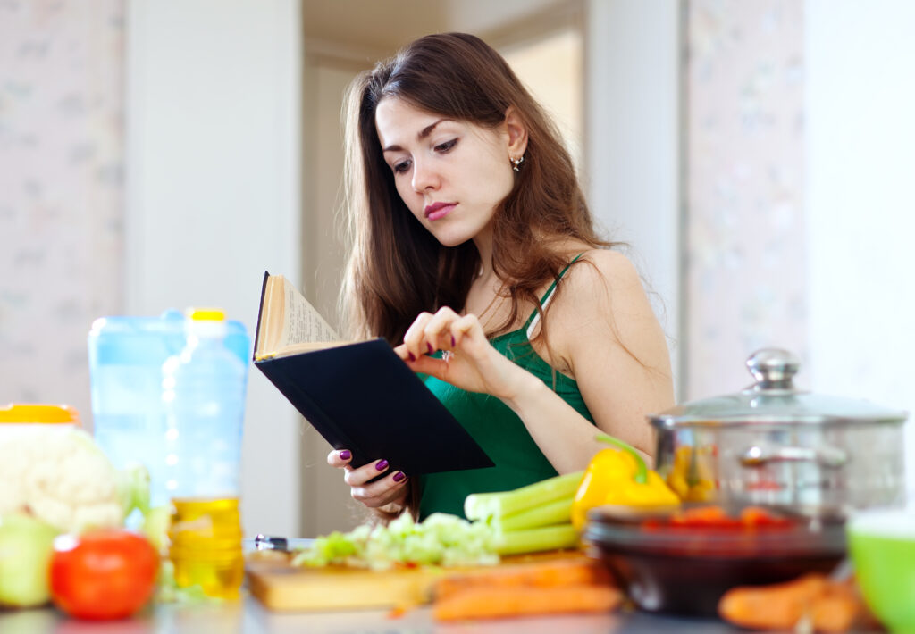 pensive housewife with cookbook